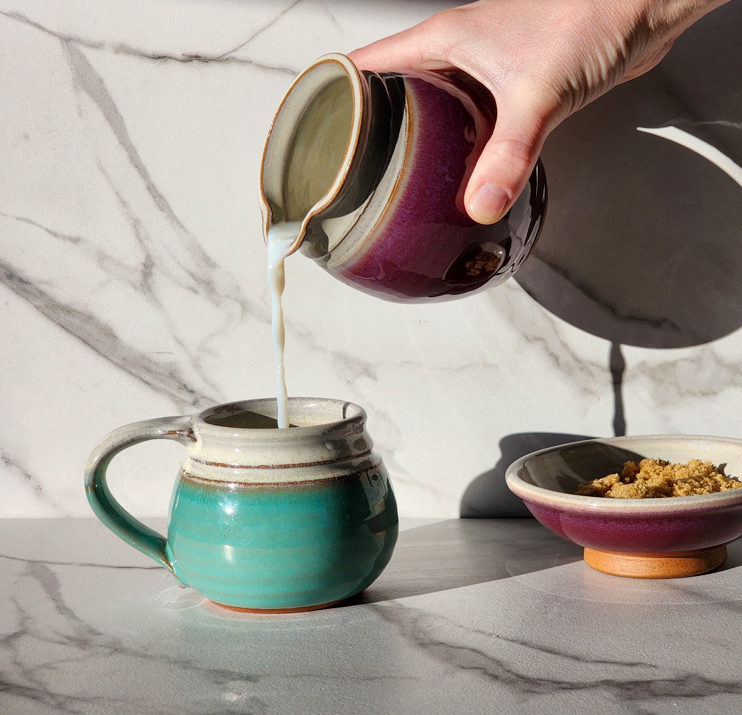 Image: Clinton Pottery's 10-12 oz Small Mug in Sky Blue – Perfect for savoring a double shot of espresso and foam or enjoying a small cup of tea/coffee. This machine washable mug seamlessly blends artistry with functionality. The soothing Sky Blue color adds a touch of tranquility, reminiscent of clear skies and calming waters.