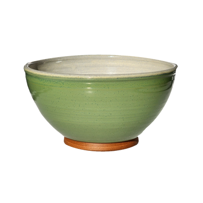  Image: A large mixing bowl in bud green, offering a capacity of 12.5 cups. The soothing green hue evokes images of fresh spring foliage, making it a delightful addition to any kitchen. Ideal for mixing ingredients for your favorite recipes.