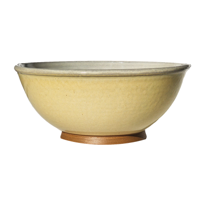 Image: A large mixing bowl in creamy butter yellow, providing ample space with a capacity of 12.5 cups. Add a touch of warmth and elegance to your culinary creations.