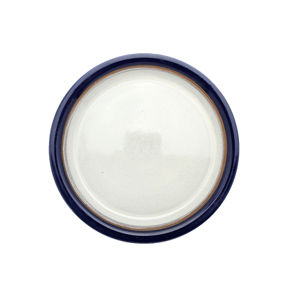 Image Description for Large Dinner Plate (10") in Cobalt: A striking cobalt dinner plate from Clinton Pottery's Handmade Dinnerware Collection. The 10-inch plate features a deep blue glaze, reminiscent of the endless sky on a clear day. Its ample size makes it an ideal choice for serving a delightful dinner with a touch of bold sophistication and elegance.