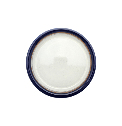 Image Description for Lunch Plate (8.5") in Cobalt: A striking cobalt lunch plate from Clinton Pottery's Handmade Dinnerware Collection. The 8.5-inch plate features a deep blue glaze, reminiscent of the endless sky on a clear day. Its versatile size makes it perfect for serving smaller meals or appetizers with a touch of bold sophistication and elegance.