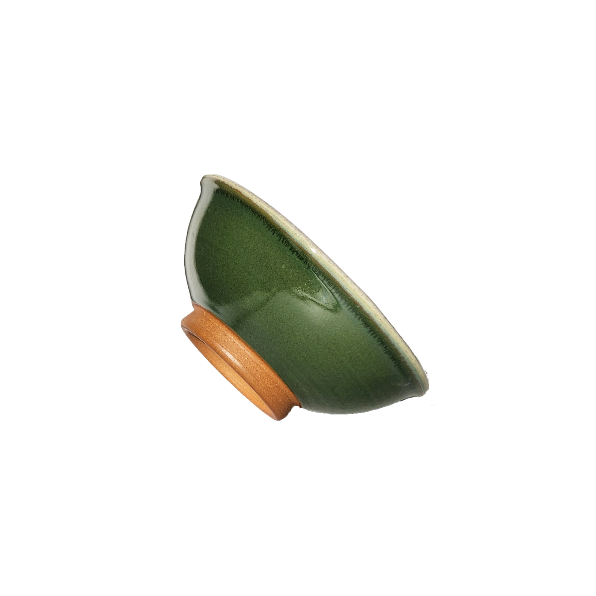 Image: A small mixing bowl in a rich dark green shade, offering a capacity of 2.25 cups. Perfect for ingredients, snacks, or condiments, this bowl brings a touch of elegance and nature-inspired charm to your kitchen.