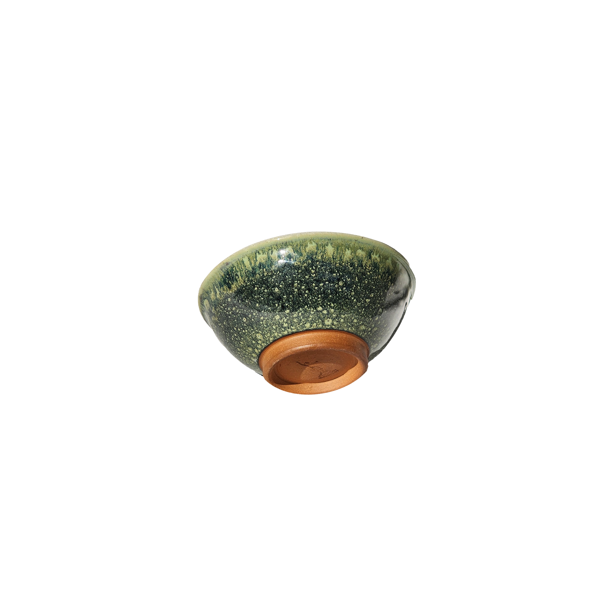 Image: A ceramic bowl in "Froggy Bottom" glaze, evoking lush green ponds and foliage. Sized at 1 cup, its smooth surface and curved edges offer practicality and charm. Ideal for snacks or condiments, it adds a touch of nature-inspired style to any table.