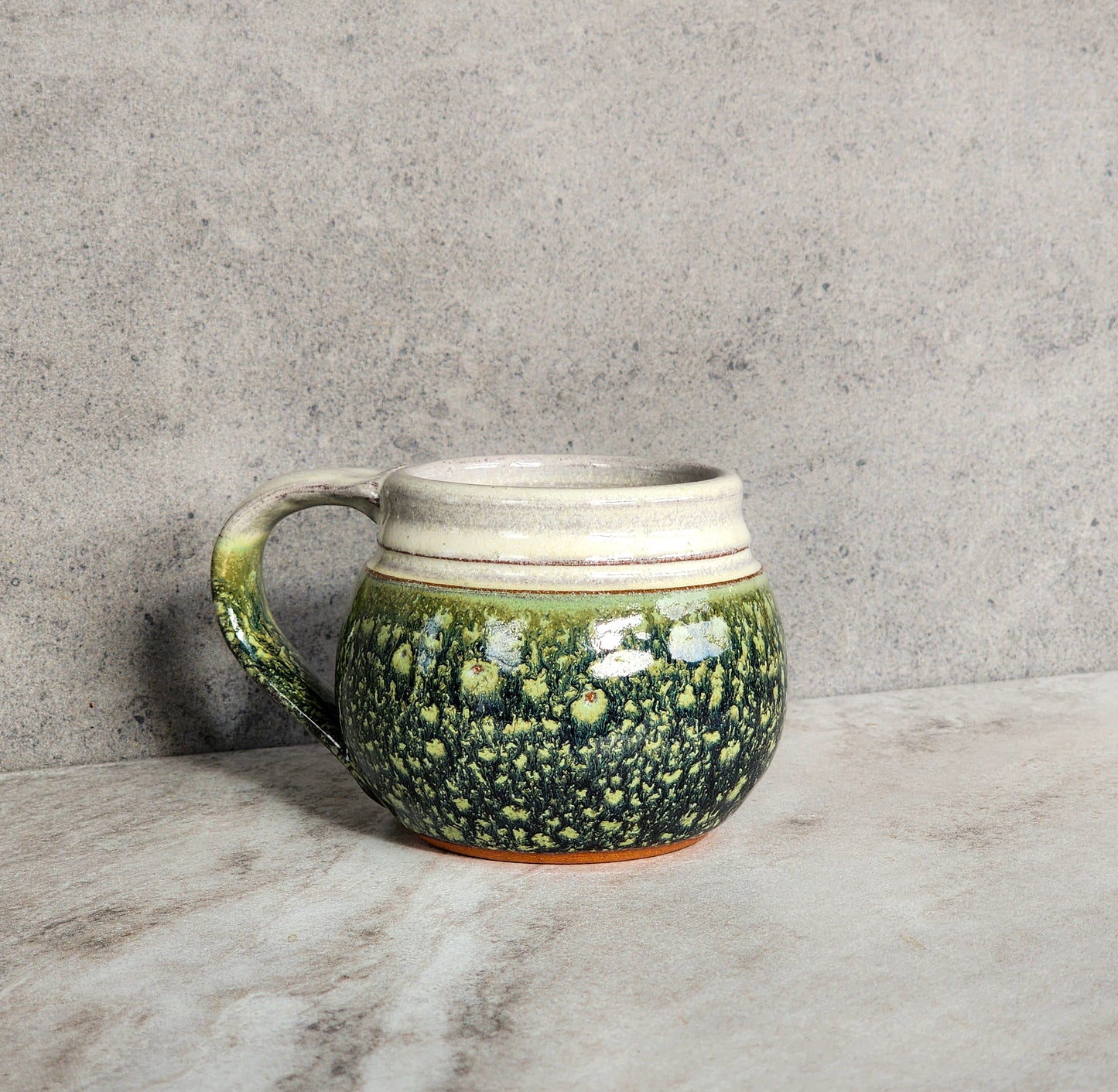 Clinton Pottery's small mug in a unique glaze color called Froggy Bottom. 