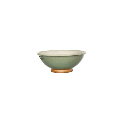 Image: A ceramic bowl in fresh light green, echoing the hues of spring foliage. Sized at 1 cup, it's perfect for serving small portions of snacks or desserts.
