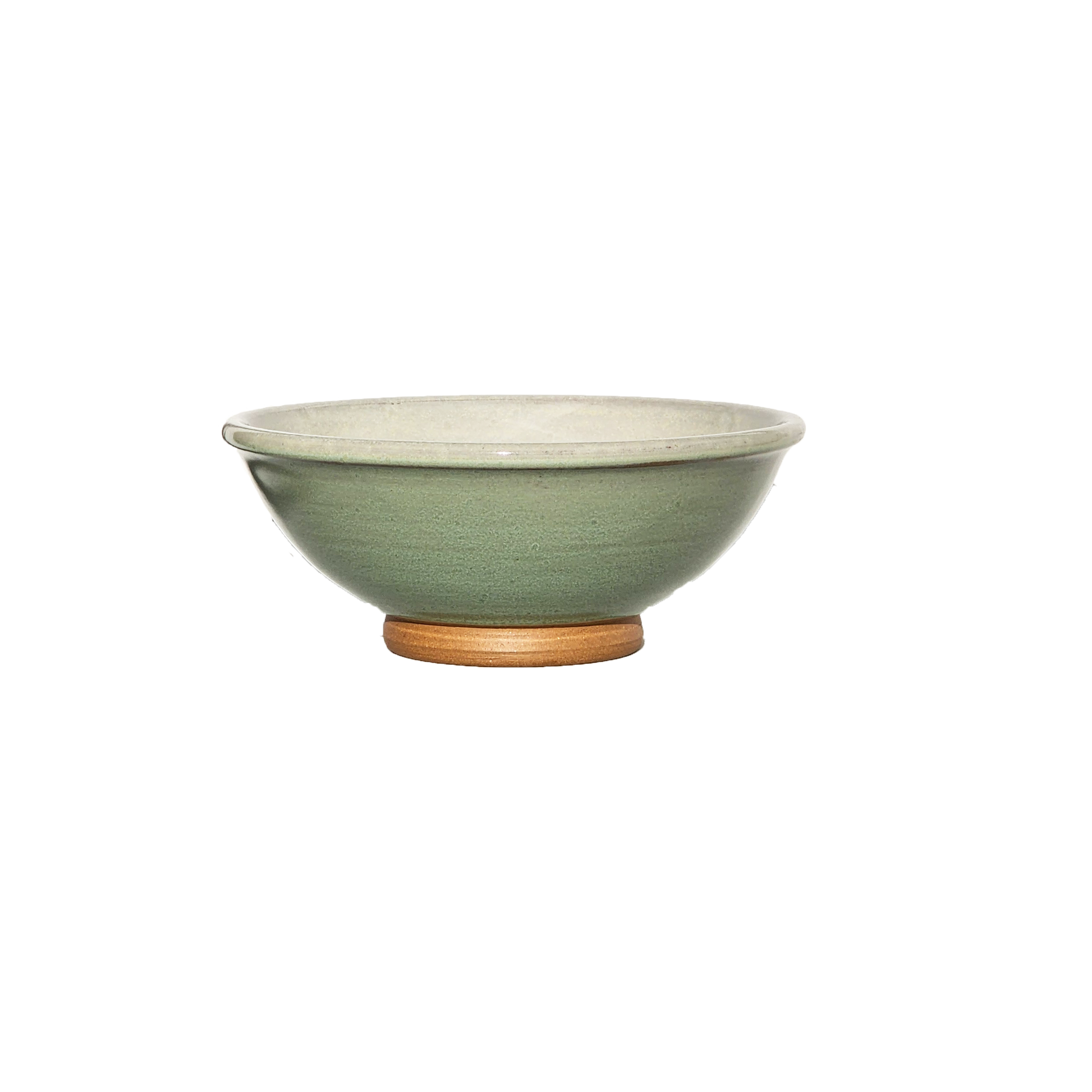 Image: A small mixing bowl in a refreshing light green color, providing a capacity of 2.25 cups. Perfect for ingredients, snacks, or condiments, this bowl adds a pop of freshness and vitality to your kitchen.