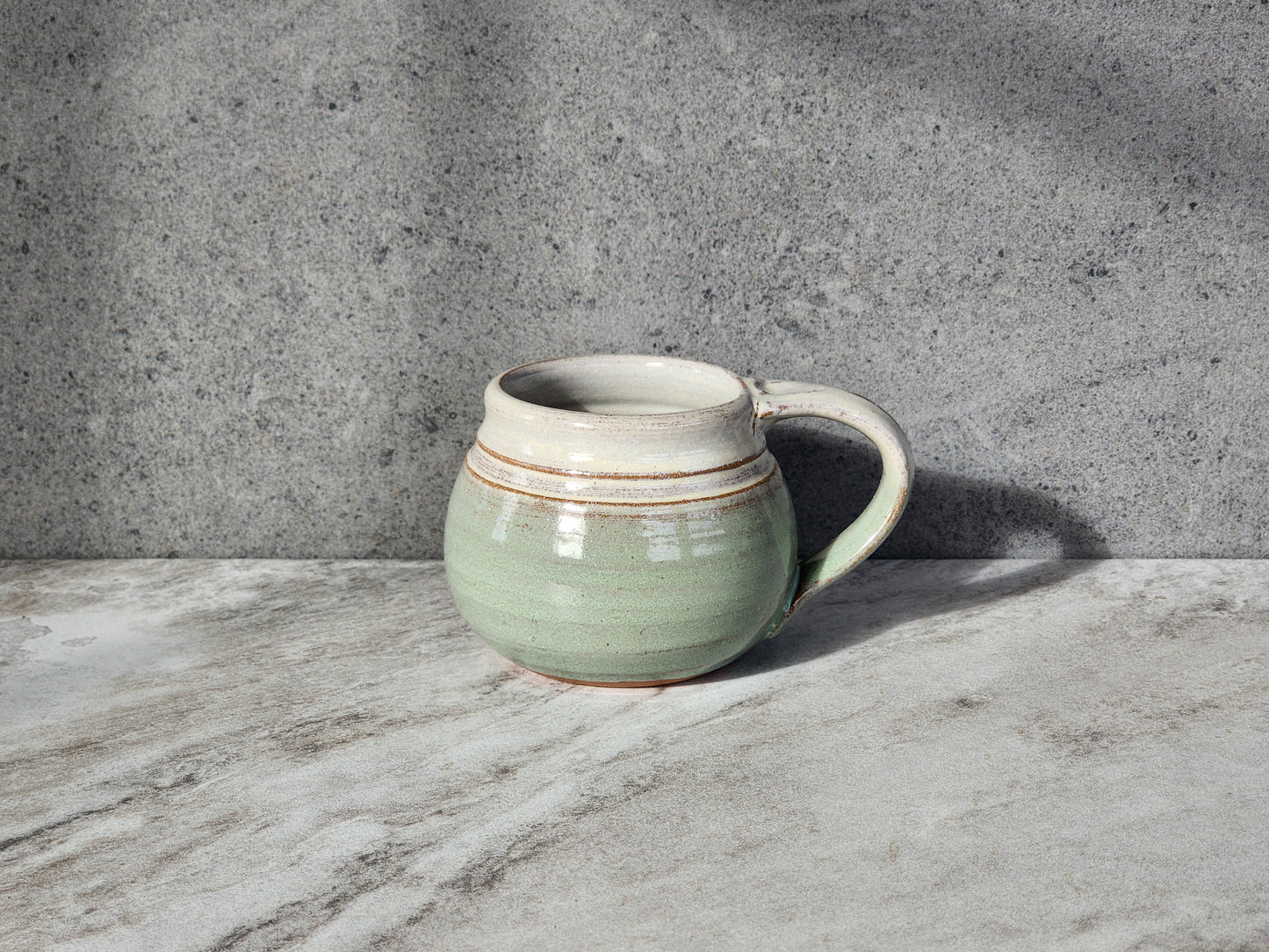 Light Green: Embrace the beauty of nature with the Light Green small mug by Clinton Pottery. Its soft, pastel hue evokes images of fresh spring leaves and blooming flowers, adding a touch of natural elegance to your beverage experience.