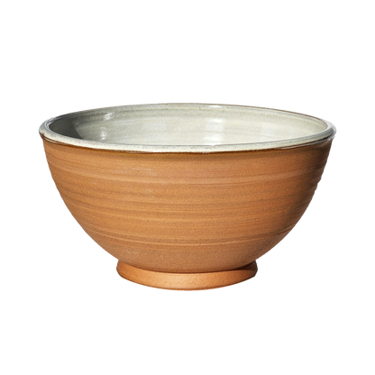 Image: A large mixing bowl in natural, unglazed ceramic, featuring a spacious design with a capacity of 12.5 cups. Embrace the rustic charm and simplicity of this earthy hue.