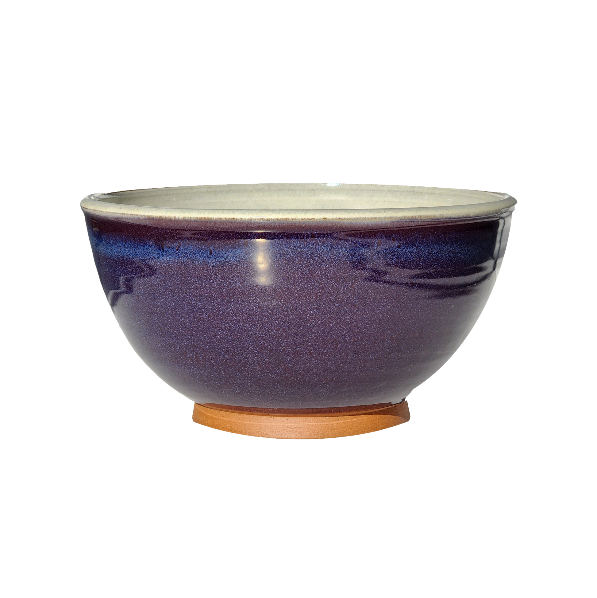 Image: A large mixing bowl in royal purple, offering generous space with a capacity of 12.5 cups. Make a bold statement in your kitchen with this regal and vibrant color.
