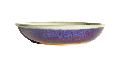 Image Description: A large pasta dish in a rich purple glaze, meticulously created by Clinton Pottery. This 10-inch dish is spacious enough to accommodate generous servings of pasta or other culinary delights, promising a touch of elegance to any dining occasion.