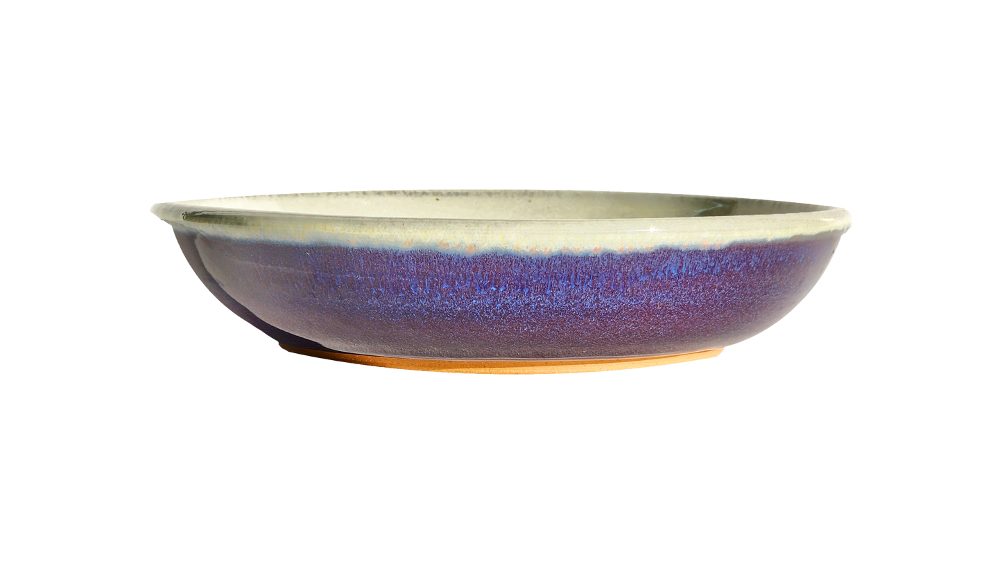 Image Description: A small pasta dish in a vibrant purple glaze, crafted by Clinton Pottery. This 8.5-inch dish is ideal for serving smaller portions of pasta or other delectable dishes, adding a pop of color to your dining experience.