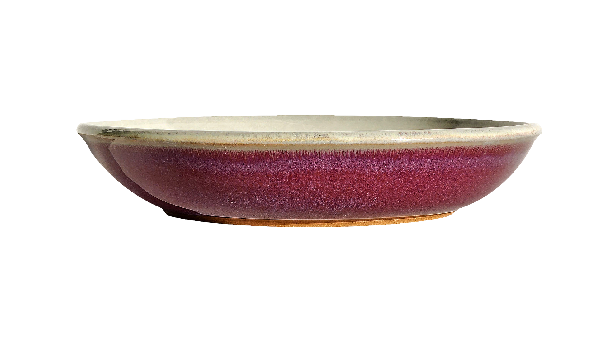 Image: A red pasta dish measuring 10 inches in diameter. Its bold color and smooth glazed surface add a touch of excitement to your dining experience, perfect for serving your favorite pasta dishes.