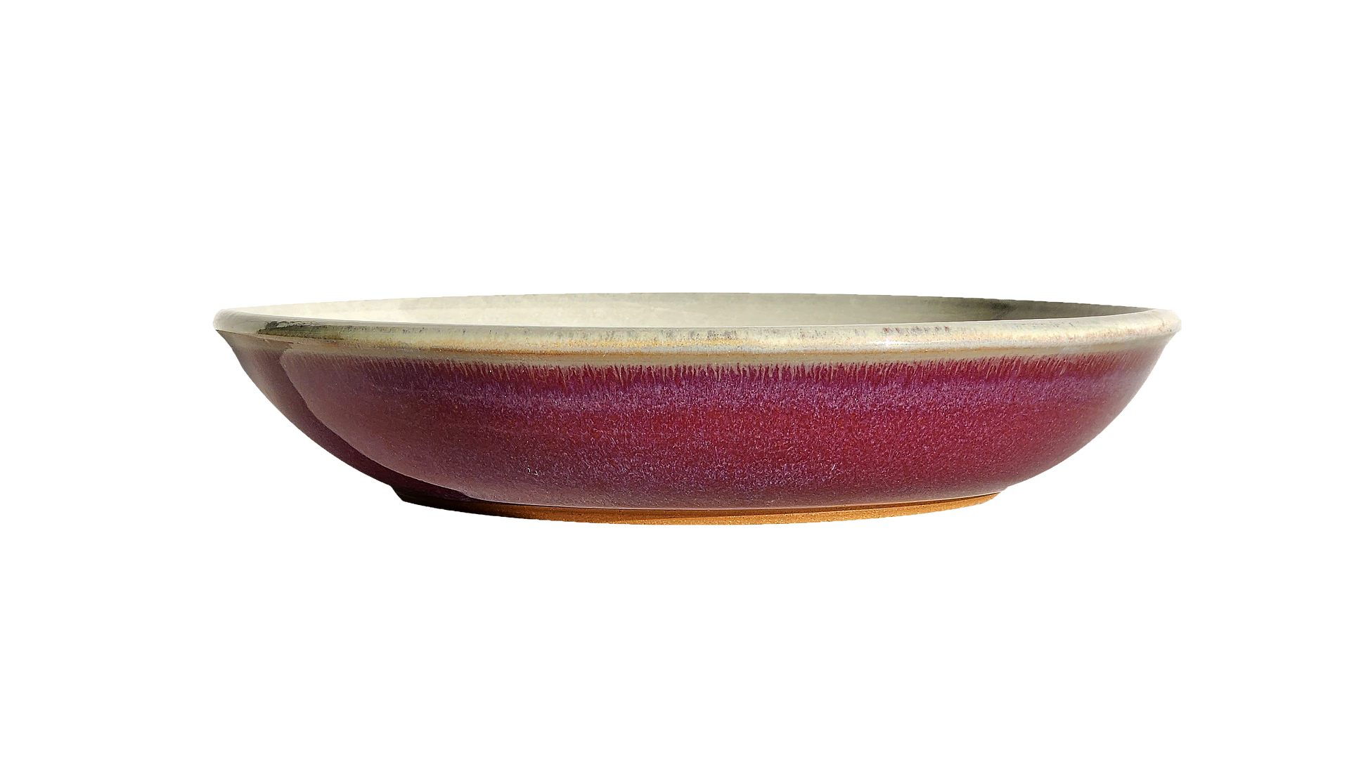 Image: A red pasta dish measuring 8.5 inches in diameter. Its bold color and smooth glazed surface add a touch of excitement to your dining experience, perfect for serving smaller portions of your favorite pasta dishes.