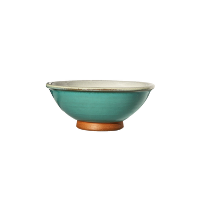 Image: A small mixing bowl in a calming sky blue shade, offering a capacity of 2.25 cups. Perfect for ingredients, snacks, or condiments, this bowl evokes a sense of openness and serenity in your kitchen.