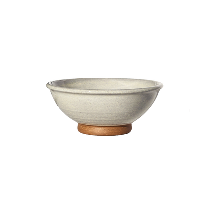 Image: A small mixing bowl in a classic white hue, providing a capacity of 2.25 cups. Perfect for ingredients, snacks, or condiments, this bowl offers timeless elegance and versatility for your kitchen needs.