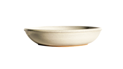 Image: A white pasta dish in the small size, measuring 8.5 inches in diameter. Made by Clinton Pottery, its clean and classic appearance makes it a versatile addition to any table setting. Perfect for serving smaller portions of pasta or other delicious dishes.